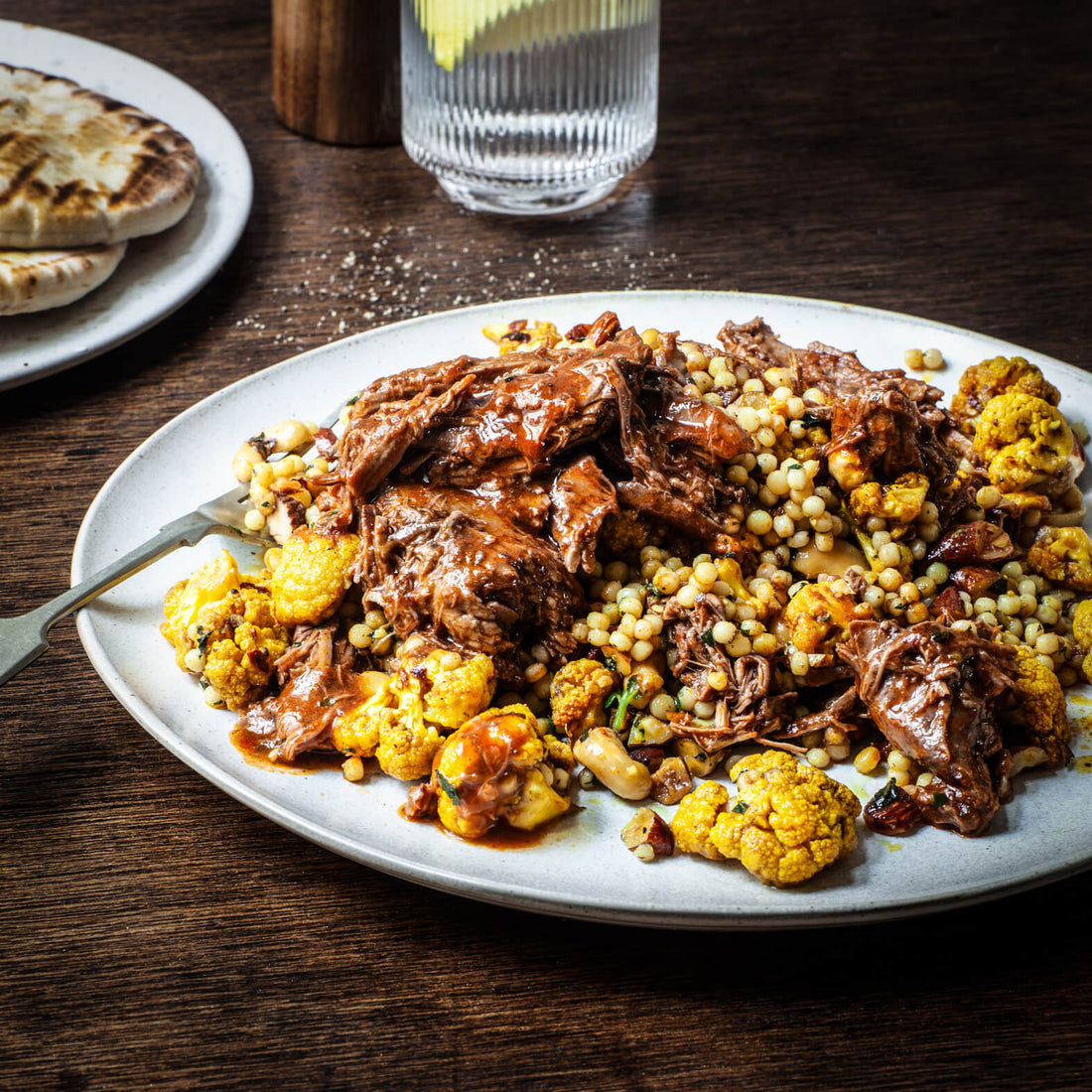 Spiced 3-hour Braised Goat with Spiced Cauliflower & Herb Fregola Salad