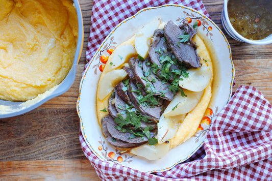 Wild Venison leg pot roast with white wine, pears and thyme